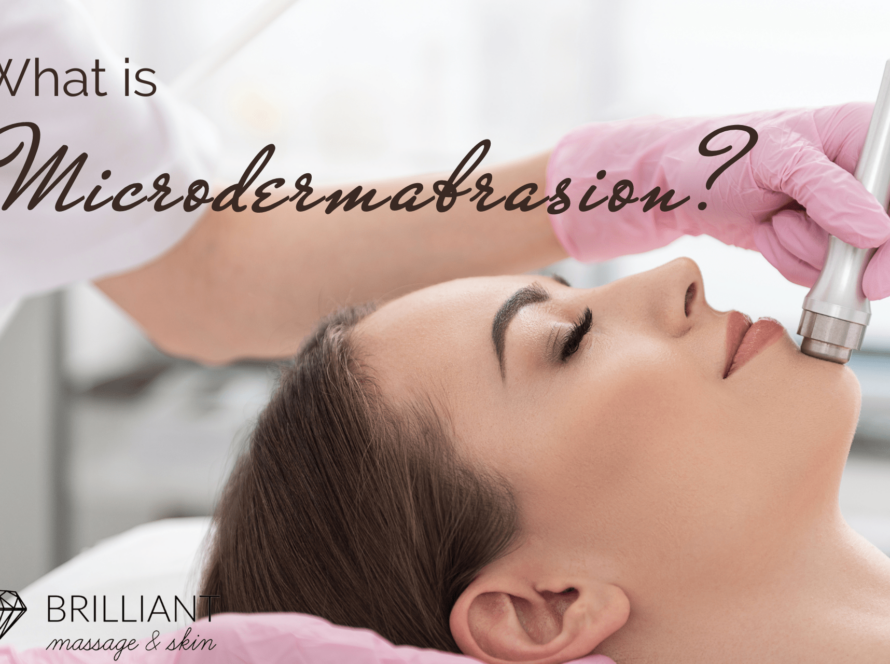 an esthetician in pink gloves doing microdermabrasion usingthe wand tool into client face: text: what is microdermabrasion