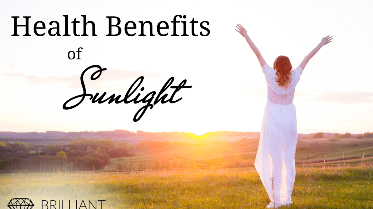 woman all in white, happily facing the sunrise in an open field with arms upward